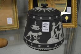 An unusual Wedgwood black jasperware jar and cover made especially for W T Lamb and Sons (lid
