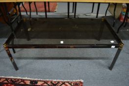 A stylish glass top coffee table.