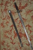 An early 19th century sword and scabbard, possibly made for theatrical use.