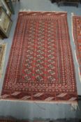 A Persian Bokhara rug 165cm x 95cm.