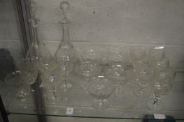 A pair of cut glass decanters and other glassware.