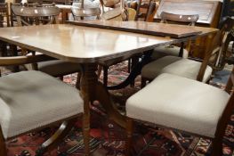 A 19th century mahogany pedestal dining table with one extra leaf.