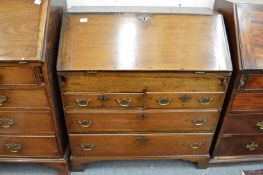 A George III oak bureau.