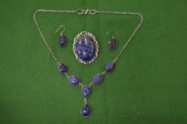 A suite of lapis jewellery.