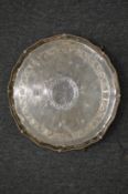 A good large silver salver with beaded border and engraved decoration on three claw and ball feet.