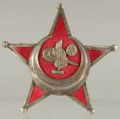 AN OTTOMAN ENAMELLED MEDAL WITH TUGHRA.