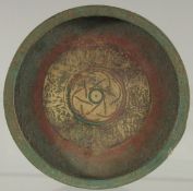 A SMALL ISLAMIC BRASS DISH, 15cm diameter.