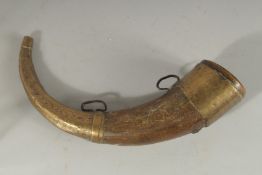 A BRASS MOUNTED BOVINE HORN, 28cm long.