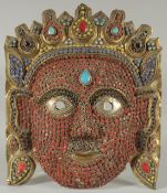 A FINE 19TH-20TH CENTURY TIBETAN OR NEPALESE CEREMONIAL MASK, 20cm x 17cm.