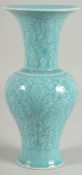 A CHINESE POWDER BLUE GLAZE PORCELAIN VASE, with carved floral motifs and bats, 25.5cm high.