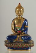 A NEPALESE ENAMELLED BRASS BUDDHA, 20cm high.