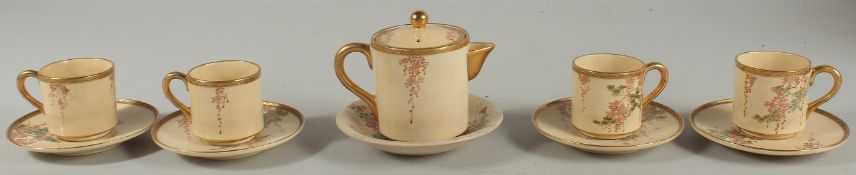 A JAPANESE SATSUMA TEA SET, comprising a teapot, four cups and saucers, together with an