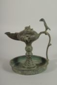 A 13TH CENTURY PERSIAN SELJUK KHURASAN BRONZE OIL LAMP, 19cm high.