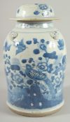 A LARGE CHINESE BLUE AND WHITE PORCELAIN LAMP STAND JAR AND COVER, painted with birds and native