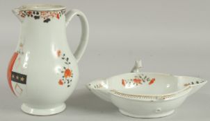 AN ARMORIAL PORCELAIN JUG AND QUATREFOIL DISH, (af), jug 18cm high, dish 21.5cm wide, (2).