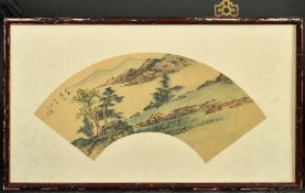 A CHINESE FAN PAINTING OF A LANDSCAPE, framed and glazed, with script and red seal, fan 48cm wide.