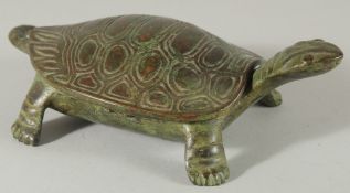 A CHINESE BRONZE TORTOISE - possibly a censer, the shell as a lid, 17cm long.