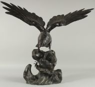 AN IMPRESSIVE JAPANESE SECTIONAL BRONZE STATUE OF AN EAGLE, with wings outstretched, stood upon a