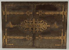 A FINE QAJAR GOLD DAMASCENED STEEL OVERLAID WOODEN TABLE CABINET, with gold inlaid tughra to the