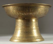 A RARE EARLY ISLAMIC MAMLUK SILVER INLAID BRASS FOOTED BOWL / TRAY STAND, with engraved panels of
