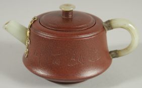 A CHINESE YIXING TEAPOT WITH MOUNDED JADE HANDLE AND SPOUT, with impressed marks to base and inner
