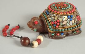 A TIBETAN FIGURE OF A TORTOISE, inlaid with various beads and shell.