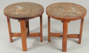 A PAIR OF BONE INLAID WOODEN STOOLS, each depicting a female figure carrying a vessel of water, 30cm