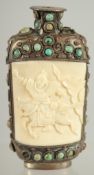A CARVED BONE INSET SNUFF BOTTLE, inset with two panels depicting warriors and further inlaid with