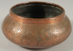 AN EGYPTIAN ENGRAVED COPPER BOWL, 17cm diameter.
