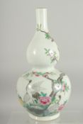 A CHINESE FAMILLE ROSE PORCELAIN DOUBLE GOURD VASE, decorated with cranes and peach blossom, base