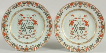 A PAIR OF CHINESE EXPORT ARMORIAL PORCELAIN PLATES, finely painted with central coat of arms with