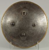 AN ISLAMIC ENGRAVED STEEL SHIELD, with four raised bosses, engraved with foliate panels containing