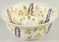 A TURKISH KUTAHYA POTTERY LEMON SQUEEZER, 14cm diameter.