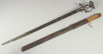 A FINE 18TH CENTURY INDIAN TULWAR SWORD WITH SILVER INLAID HILT, sheathed within a leather