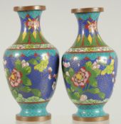 A PAIR OF CHINESE BLUE GROUND CLOISONNE VASES, with floral decoration, 16cm high.