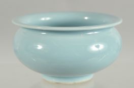 A CHINESE POWDER BLUE PORCELAIN BRUSH WASHER, mark to base, 9.5cm diameter.