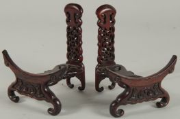 A PAIR OF CHINESE CARVED AND PIERCED WOODEN STANDS.