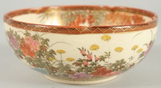A JAPANESE SATSUMA PETAL FORM BOWL, painted with birds and native flora with fine gilt highlights,