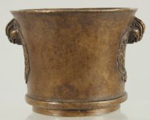A CHINESE BRONZE TWIN HANDLE CENSER, 8.5cm high.