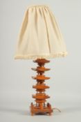 A CHINESE CARVED BOXWOOD PAGODA FORM LAMP, with shade, 51cm high overall.