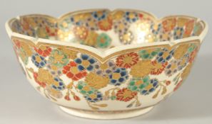 A JAPANESE SATSUMA PETAL-FORM BOWL, decorated with multiple flower heads and gilt highlights, the