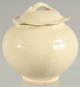 A CHINESE DING WARE PORCELAIN JAR AND COVER, 12cm high.