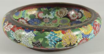 A LARGE CHINESE CLOISONNE BOWL, decorated all over with various colourful flower heads, the base
