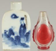 TWO 19TH CENTURY CHINESE SNUFF BOTTLES, one blue and white porcelain painted with two figures, the