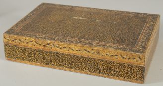 A KASHMIRI LIDDED WOODEN BOX, 24cm x 15.5cm.