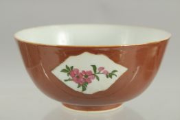 A CHINESE FAMILLE ROSE PANELLED PORCELAIN BOWL, possibly Kangxi, 12cm diameter.