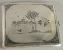 A FINE SIGNED IRAQI NIELLO INLAID SILVER CIGARETTE CASE, 9cm x 8cm.