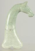 A CARVED HARDSTONE DAGGER HANDLE IN THE FORM OF A HORSE HEAD, 16cm long.
