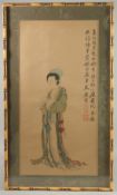 A CHINESE PAINTING ON SILK, depicting a robed female figure, with calligraphy inscription to the top