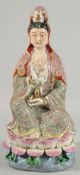 A CHINESE FAMILLE ROSE PORCELAIN GUANYIN FIGURE, seated upon a lotus base, impressed mark beneath,